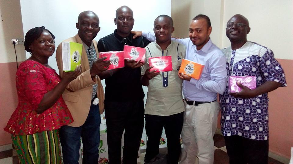 A group of Agel distributors holding product boxes